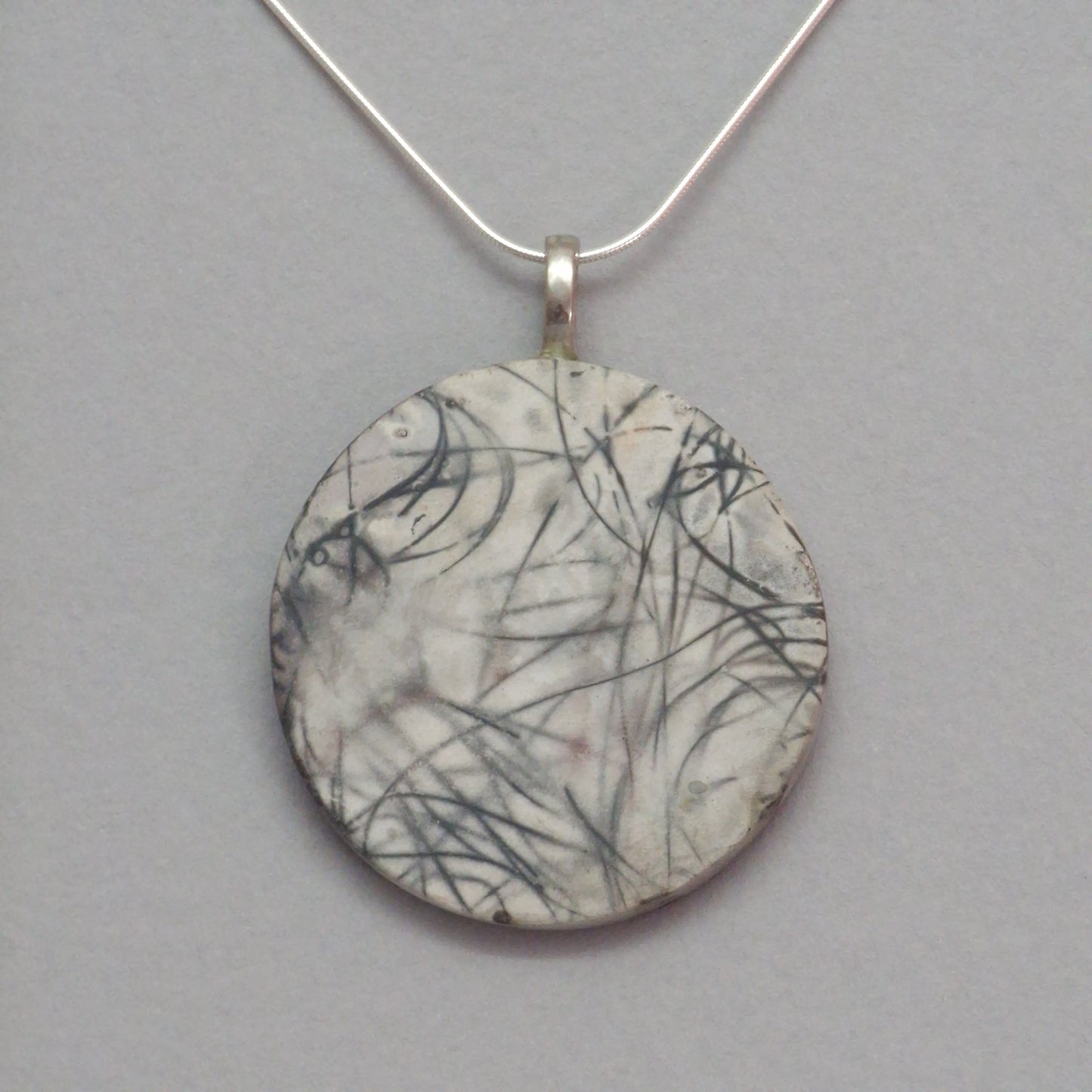 Smoke fired ceramic pendant