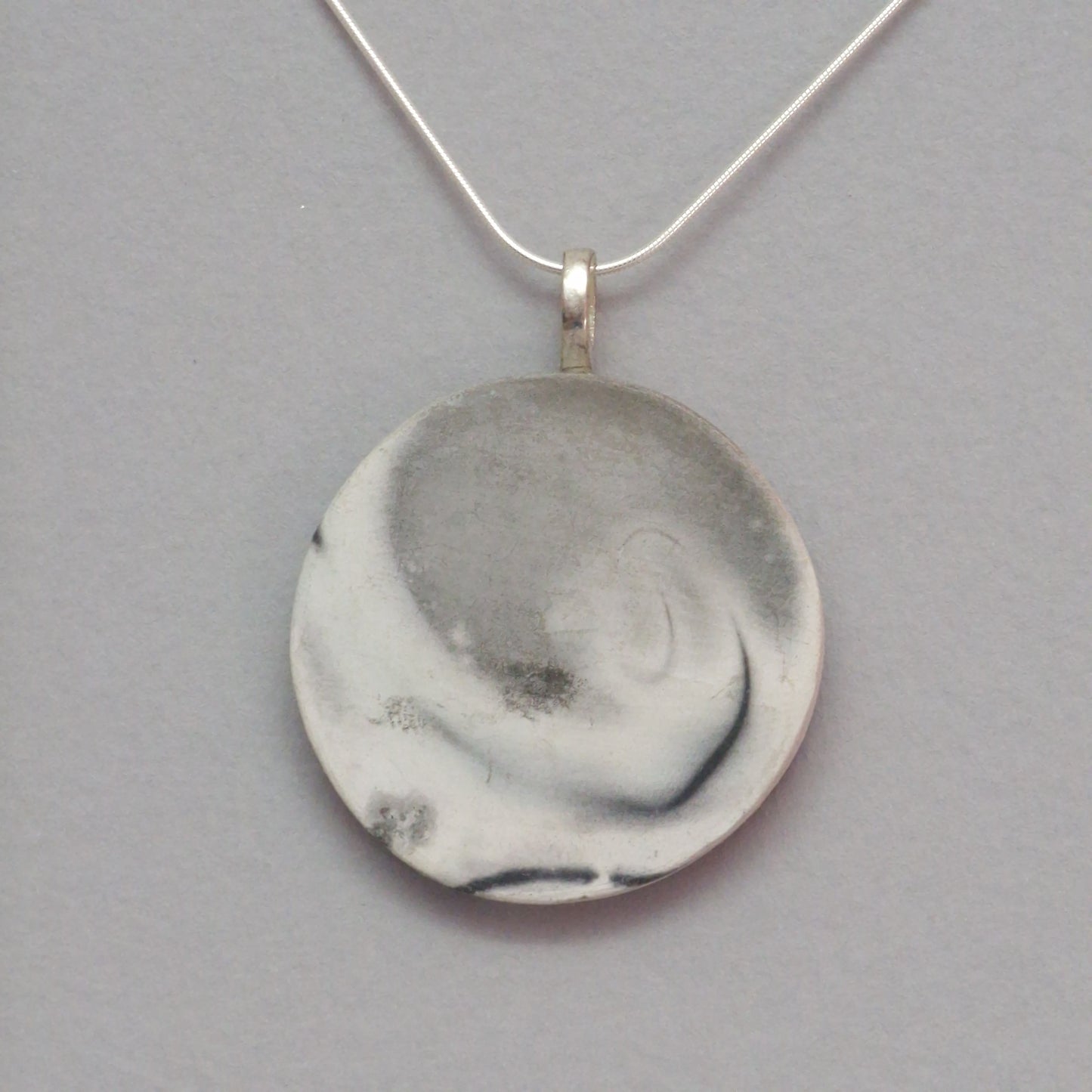 Smoke fired ceramic pendant