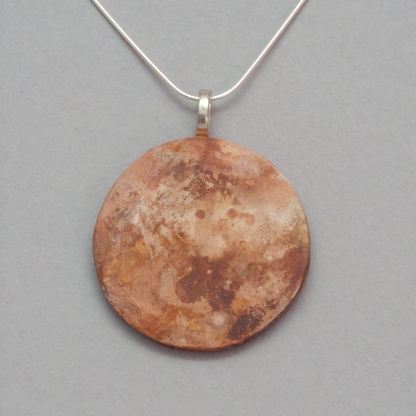 Smoke fired ceramic pendant