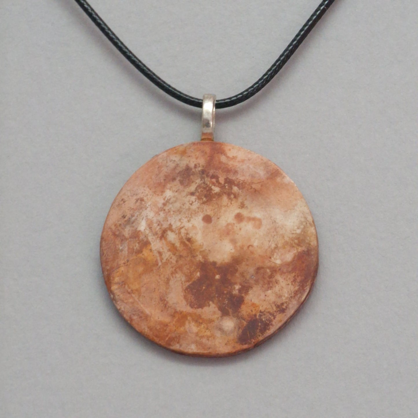 Smoke fired ceramic pendant