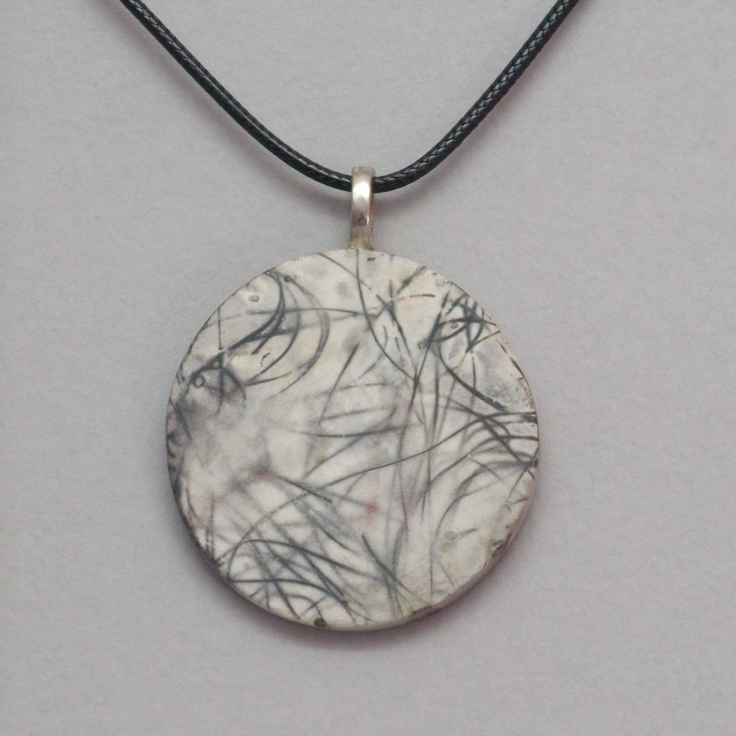 Smoke fired ceramic pendant