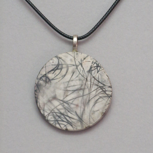 Smoke fired ceramic pendant