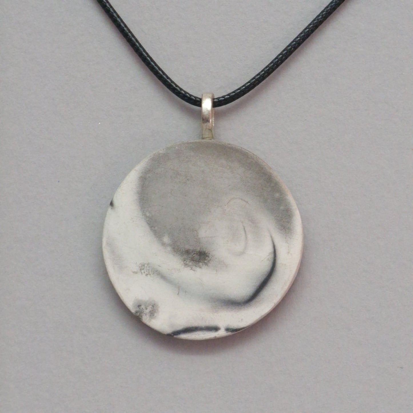 Smoke fired ceramic pendant