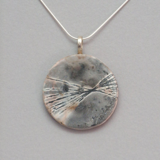 Smoke fired ceramic pendant