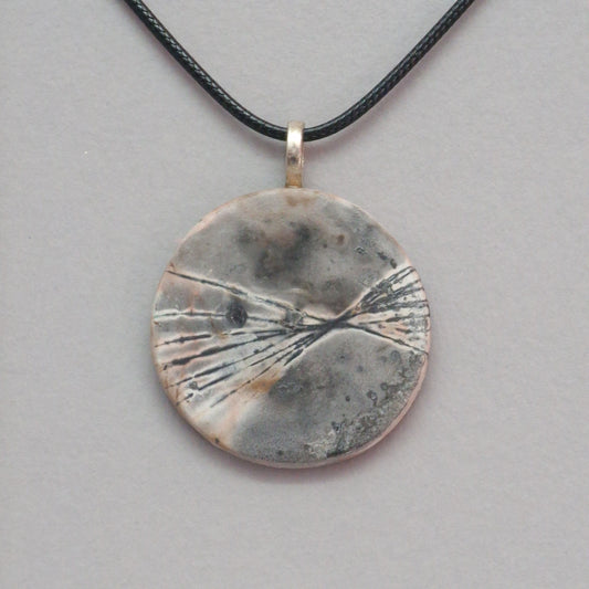 Smoke fired ceramic pendant