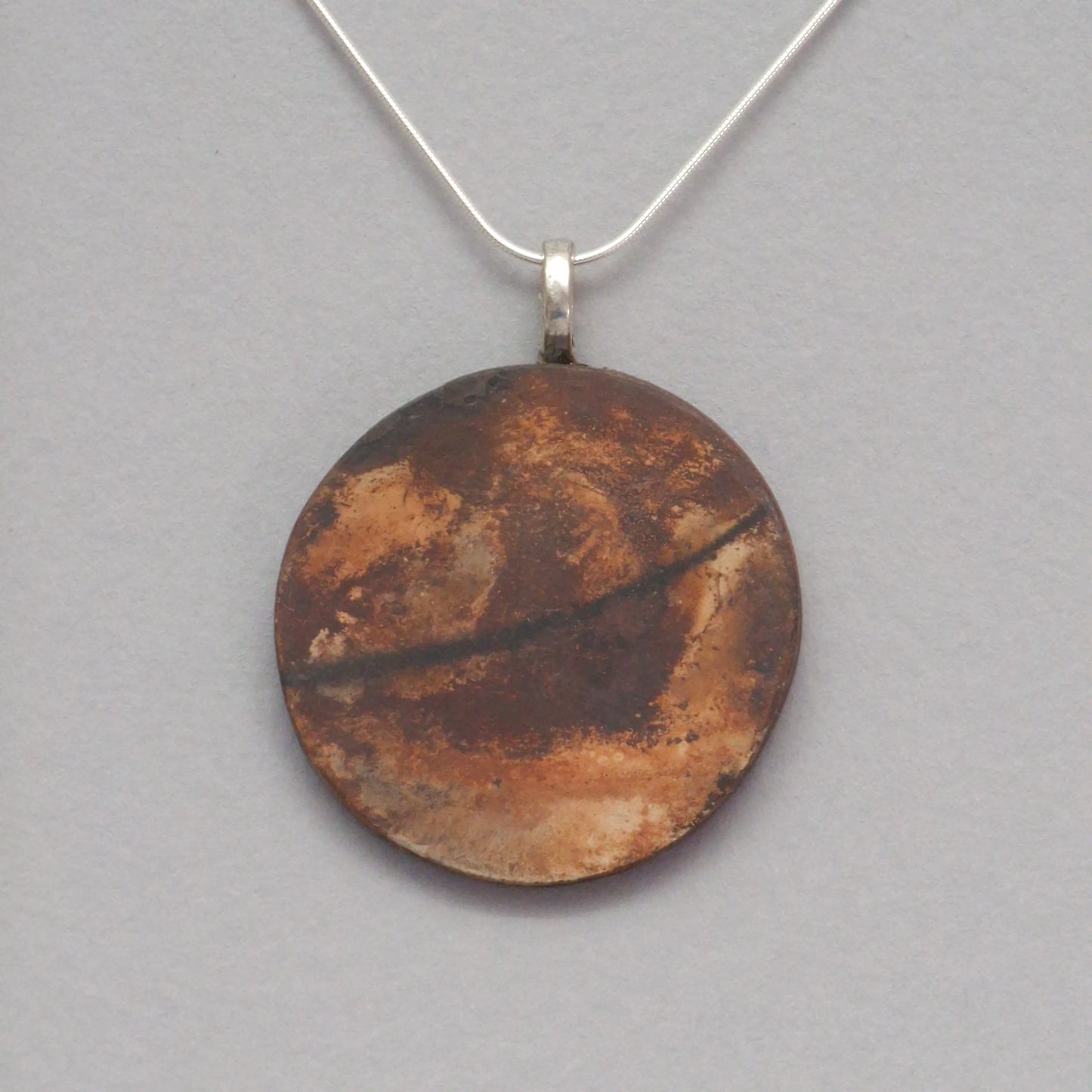 Smoke fired ceramic pendant