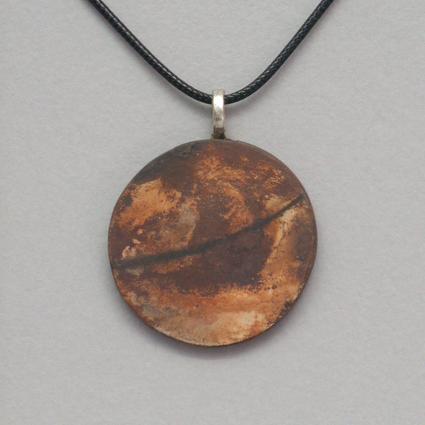 Smoke fired ceramic pendant