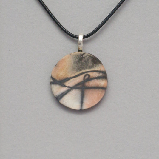Smoke fired ceramic pendant